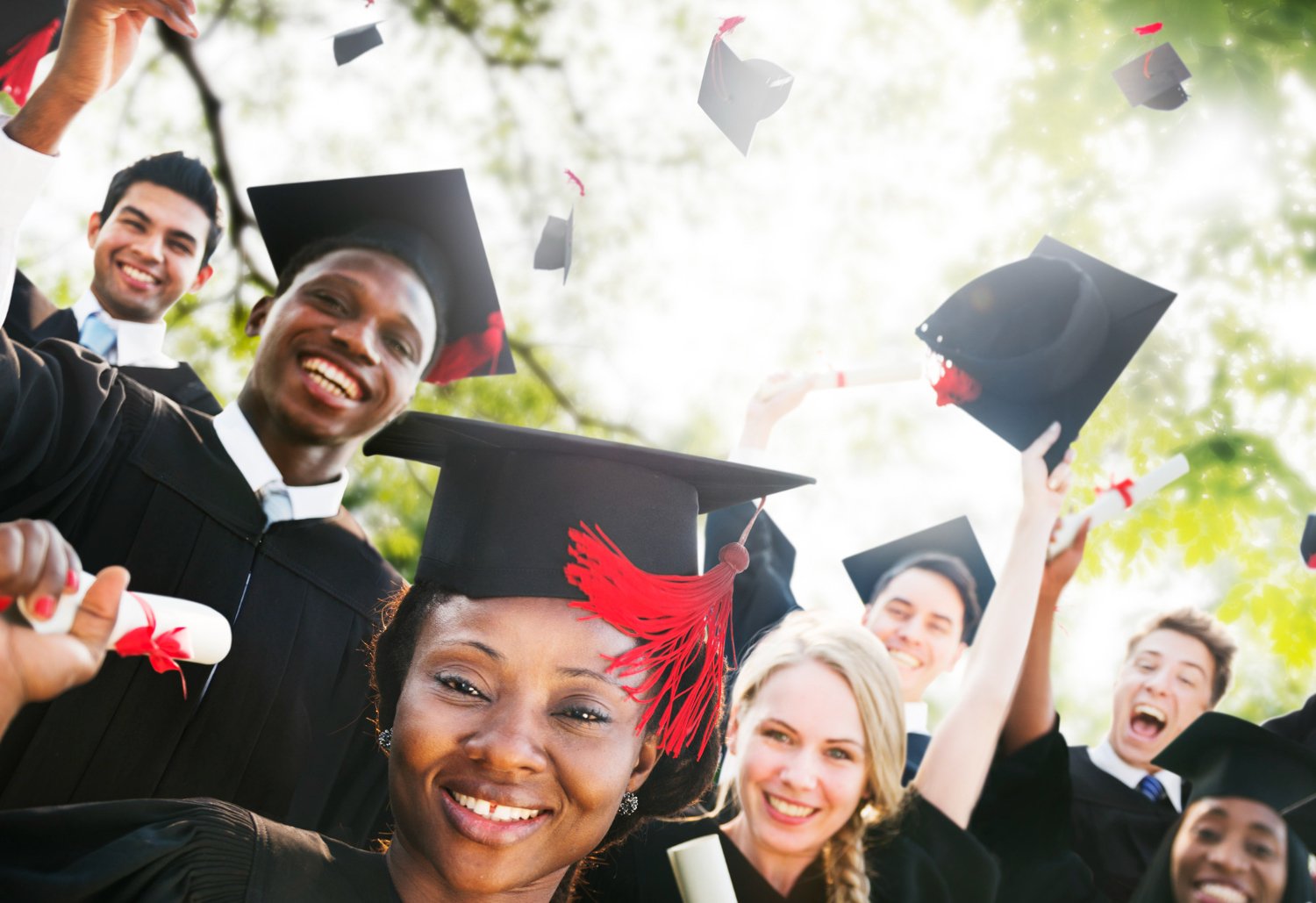 a student celebrating with arms raised, holding a diploma, confetti falling around, symbolizing scholarship success and academic achievement in a bright, modern setting